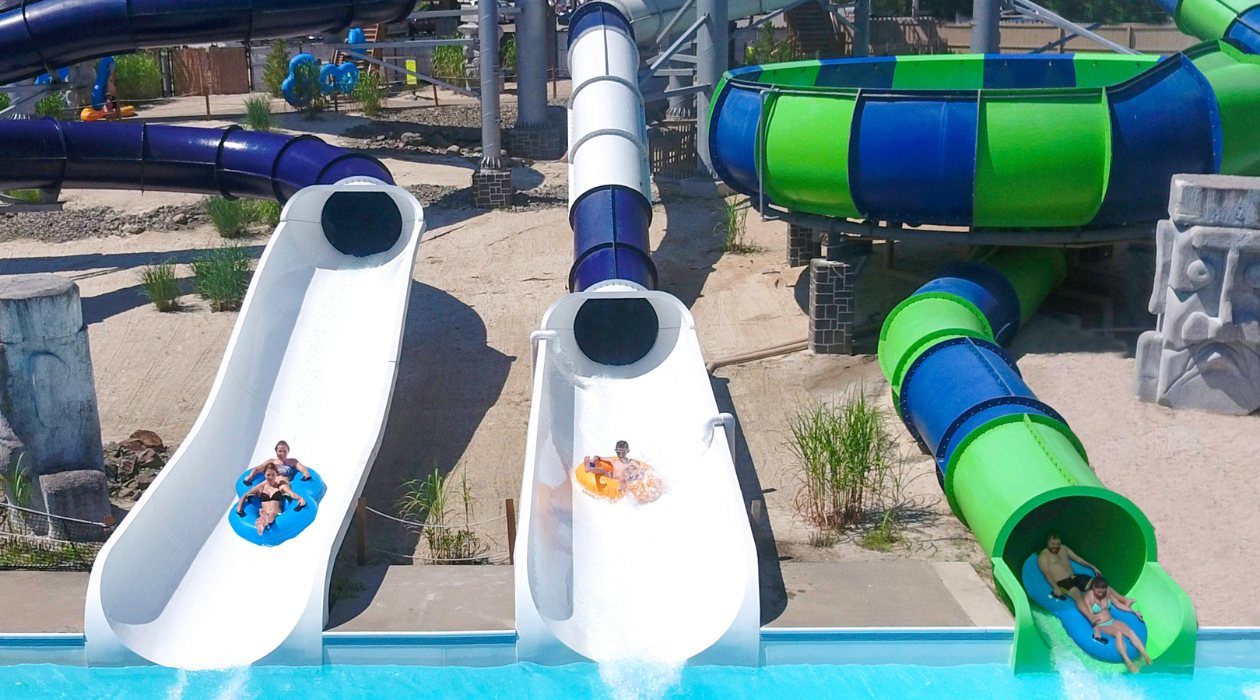 SplashDown Beach Water Park three slides with kids racing into the pool
